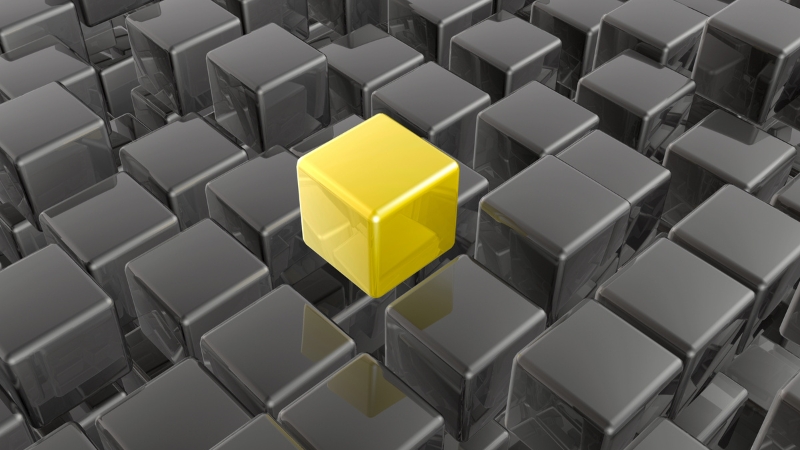 picture showing that everything thing is grey cube except one cube is yellow